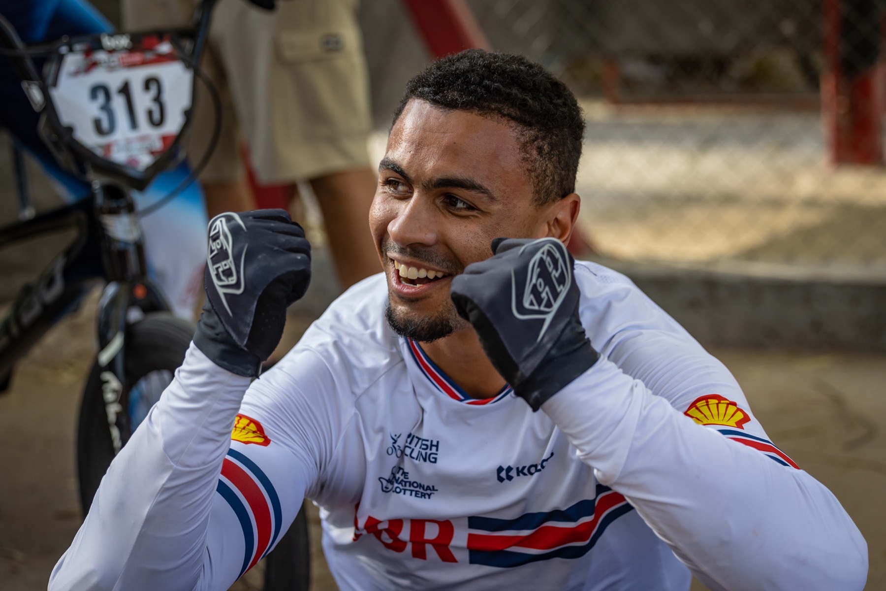 Quillan Isidore smiling with his fists raised