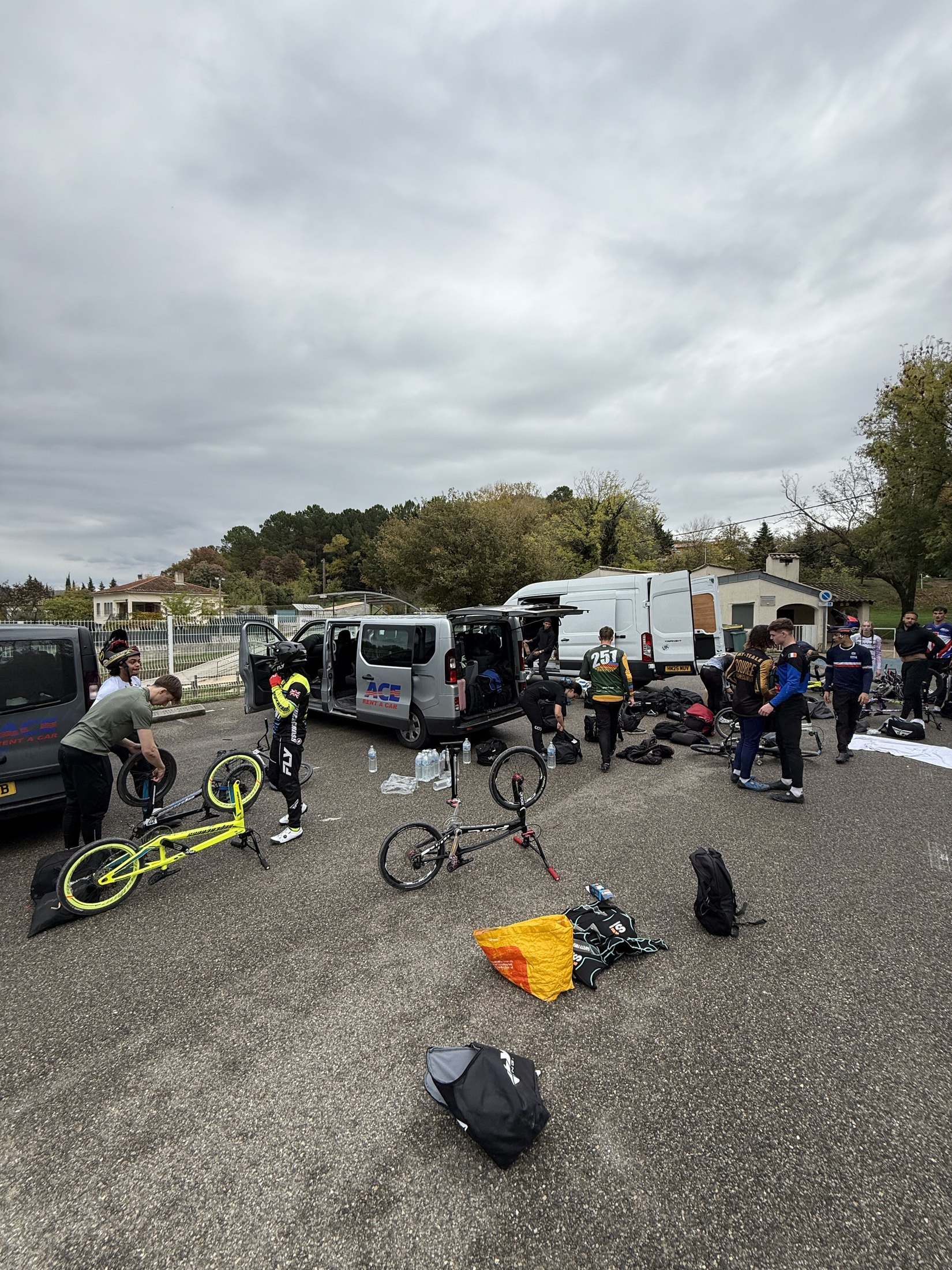 Riders unpacking and preparing their bikes